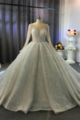 Wanna get a dress in Tulle, Ball Gown style, and delicate Beading,Appliques,Ruffless work? We meet all your need with this Classic Shiny Ball Gown Tulle Jewel Long Sleevess Ruffless Wedding Dress at factory price.