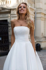 stylesnuggle custom made you this Simple Strapless White A-line Zipper up A-line Princess Wedding Dress comes in all sizes and colors.Fast delivery worldwide.