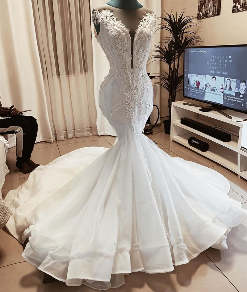 This Sleeveless Beads Appliques Mermaid Wedding Dresses Sheer Tulle V-neck Tulle Bridal Gowns at stylesnuggle comes in all sizes and colors. Shop a selection of formal dresses for special occasion and weddings at reasonable price.