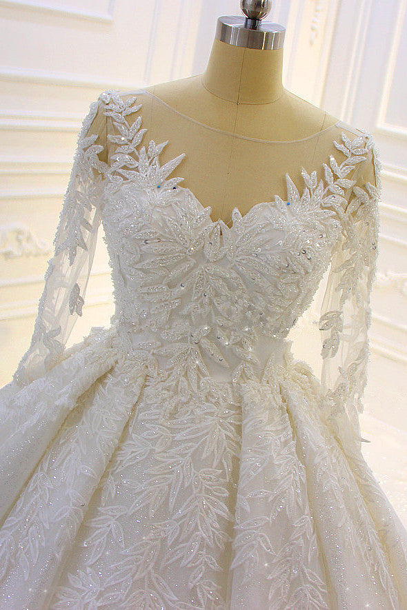 Finding a dress in Tulle, Ball Gown style, and delicate Lace,Beading,Appliques work? stylesnuggle custom made you this Sparkle 3D Lace Appliques Long Sleevess Church Train Wedding Dress at factory price.