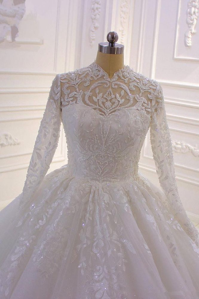 Wanna get a dress in Tulle, Ball Gown style, and delicate Lace,Beading,Appliques,Ruffless work? We meet all your need with this Classic Sparkle Lace Ball Gown High Neck Tull Long Sleevess Wedding Dress at factory price.