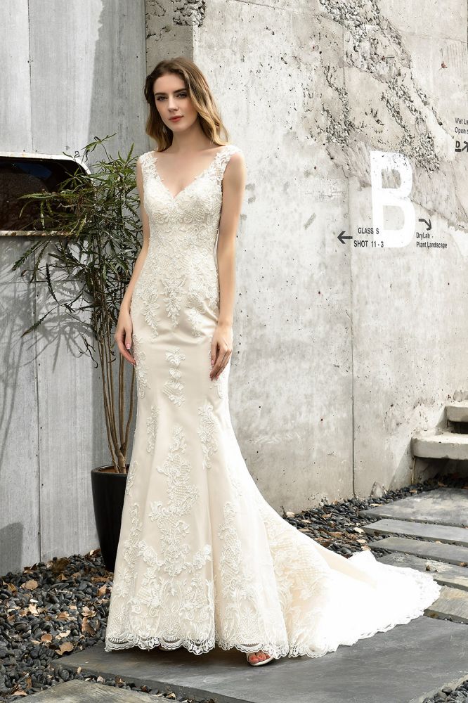 Can't decide what to wear for your big day. stylesnuggle has Fit-and-flare Lace Open Back Beach Wedding Dress avilable in White, Ivroy and champange. Try this simple bridal gowns for your summer wedding.