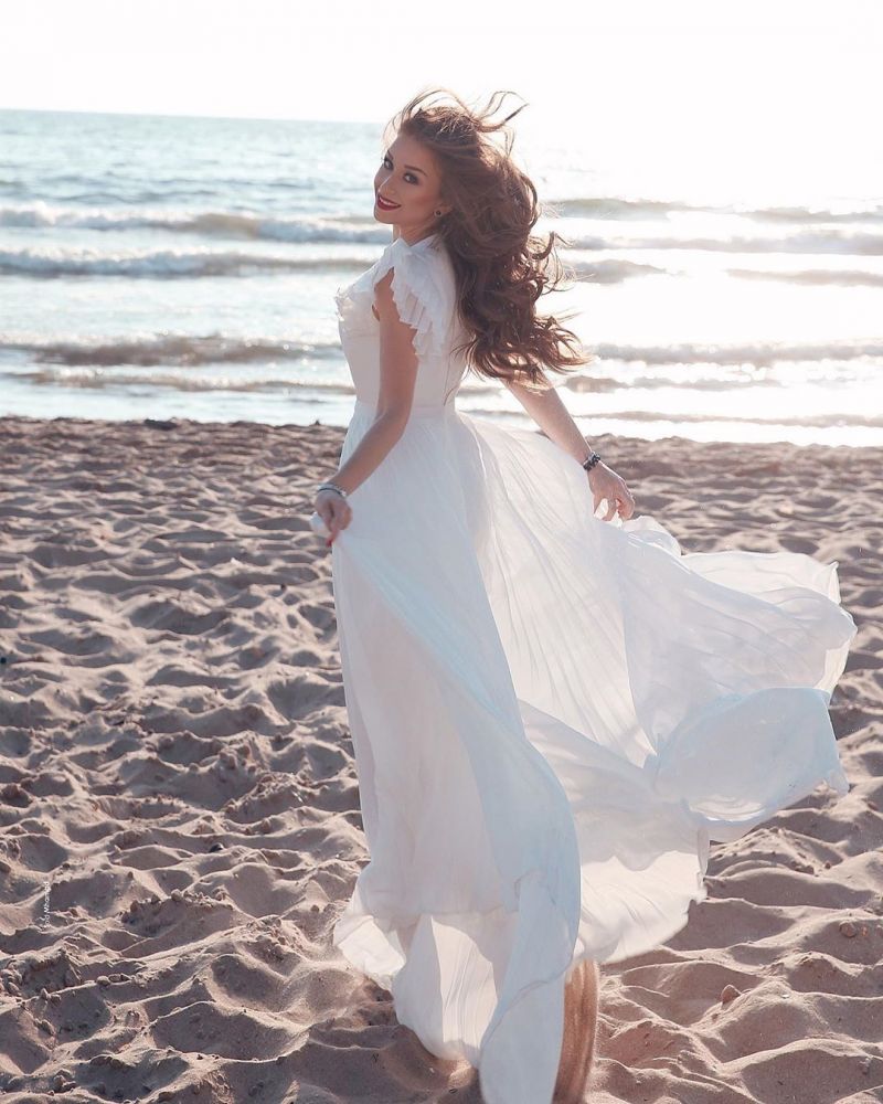 stylesnuggle offers White Chiffon Ruffless Sleeves V-neck Summer Beach Wedding Dress at factory price from White,Ivory,Champagne,Black, 100D Chiffon to A-line Floor-length hem. All sold at reasonable price